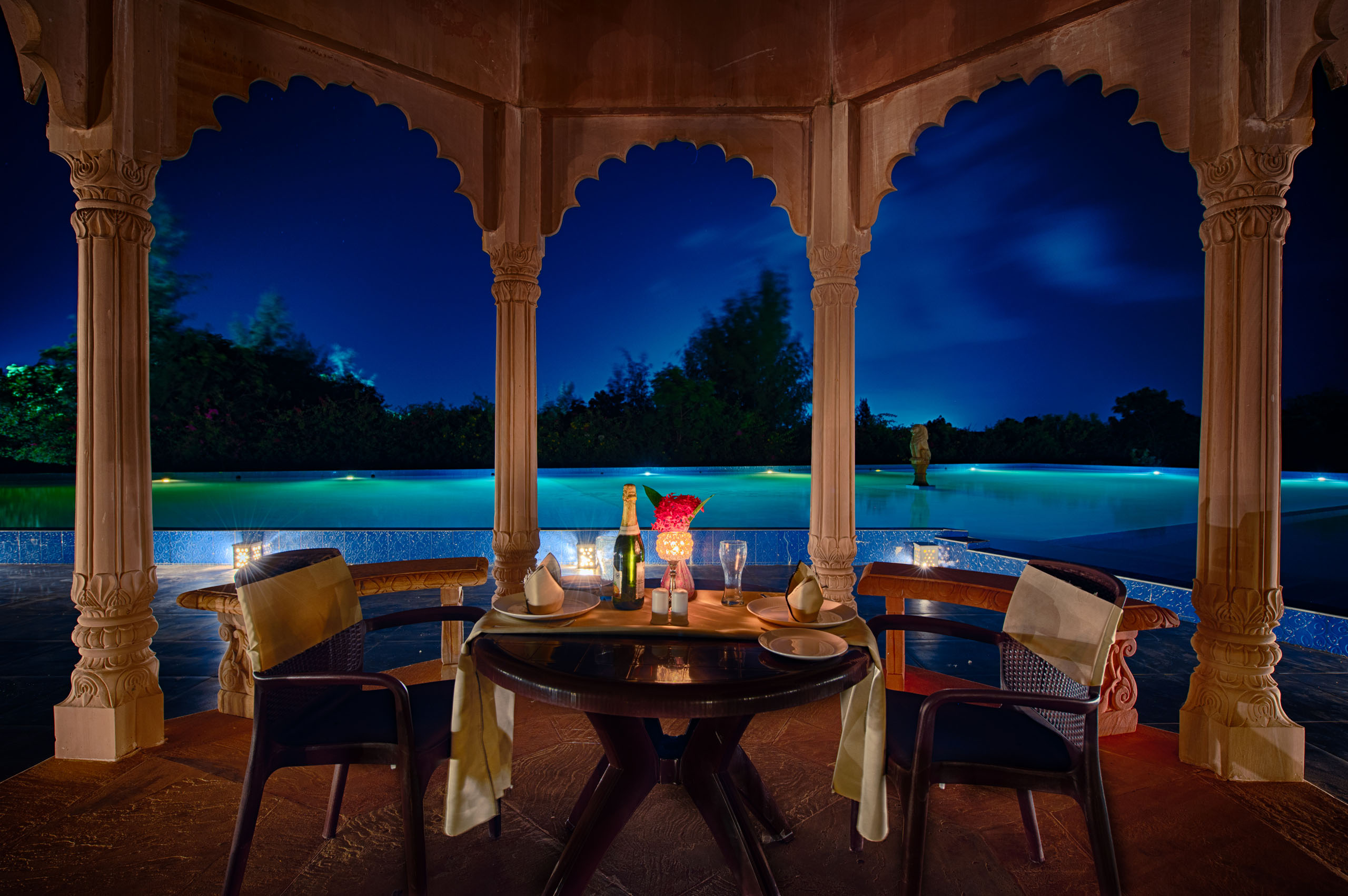 Aerial view of a resort pool at blue hour